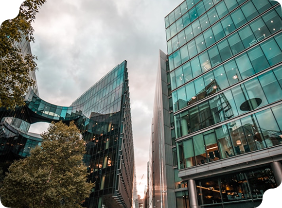 Modern glass office buildings in a city.
